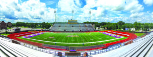 View of Tucker Stadium at the 50-yard-line on a bright, sunny day.