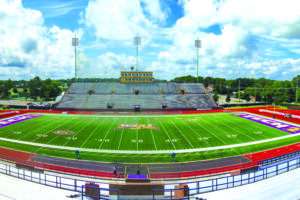 View of Tucker Stadium at the 50-yard-line on a bright, sunny day.