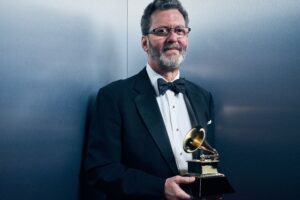 Blanton Alspaugh poses with a Grammy award.